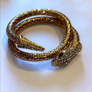 Snake Coil Gold Tone Mesh wraparound bracelet with rhinestones.